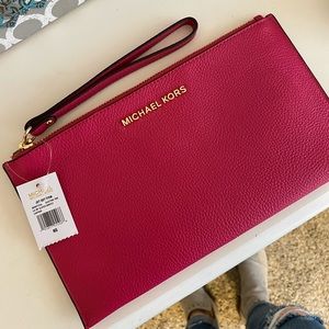 Brand new, never used  pink Michael Kors Wristlet